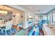 Open concept dining area with a white table and blue accents at 2589 Redwood Cir, Clearwater, FL 33763