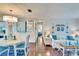 Open concept dining area with white table and chairs at 2589 Redwood Cir, Clearwater, FL 33763