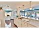 Kitchen features white cabinets and marble counters at 2589 Redwood Cir, Clearwater, FL 33763