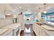 Bright white kitchen with marble countertops and stainless steel appliances at 2589 Redwood Cir, Clearwater, FL 33763