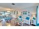 Open concept living and dining area with hardwood floors at 2589 Redwood Cir, Clearwater, FL 33763
