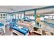 Living area with white couch and blue striped armchairs at 2589 Redwood Cir, Clearwater, FL 33763