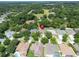 Home's location in a residential neighborhood, surrounded by trees at 2715 Durant Trails Blvd, Dover, FL 33527