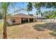 Spacious backyard with screened patio and large grassy area at 2715 Durant Trails Blvd, Dover, FL 33527
