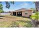 Backyard view showing a house with a screened patio at 2715 Durant Trails Blvd, Dover, FL 33527