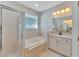 Bathroom features a shower, bathtub, and granite countertop at 2715 Durant Trails Blvd, Dover, FL 33527