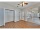 Bedroom with wood floors, closet, and access to patio at 2715 Durant Trails Blvd, Dover, FL 33527