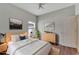 Virtually staged bedroom with wood floors and neutral colors at 2715 Durant Trails Blvd, Dover, FL 33527