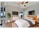 Virtually staged bedroom with wood flooring and sliding doors at 2715 Durant Trails Blvd, Dover, FL 33527