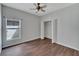 Bedroom with wood floors and a double-door closet at 2715 Durant Trails Blvd, Dover, FL 33527