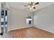 Bedroom with wood flooring and sliding glass doors at 2715 Durant Trails Blvd, Dover, FL 33527