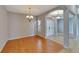 Dining room with hardwood floors and a chandelier at 2715 Durant Trails Blvd, Dover, FL 33527