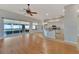 Open floor plan Gathering room with kitchen access and hardwood floors at 2715 Durant Trails Blvd, Dover, FL 33527