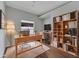 Virtually staged home office with built-in shelving at 2715 Durant Trails Blvd, Dover, FL 33527