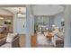 Virtually staged living room with light gray walls and wood floors at 2715 Durant Trails Blvd, Dover, FL 33527
