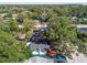 Aerial view of a house nestled in a lush, tree-lined neighborhood at 3020 Deleuil Ave, Tampa, FL 33610