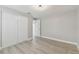 Bright bedroom with light grey walls and vinyl plank flooring at 3020 Deleuil Ave, Tampa, FL 33610