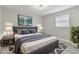Spacious bedroom with a king-size bed and stylish decor at 3020 Deleuil Ave, Tampa, FL 33610