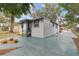 Updated home exterior with landscaping and driveway at 3020 Deleuil Ave, Tampa, FL 33610