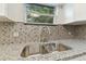 Stainless steel sink and granite countertop at 3020 Deleuil Ave, Tampa, FL 33610