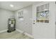 Laundry room with exterior access and vinyl flooring at 3020 Deleuil Ave, Tampa, FL 33610