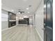 Bright and airy living room with a view into the kitchen at 3020 Deleuil Ave, Tampa, FL 33610