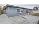 Exterior view of the concrete patio and Florida room addition at 3205 Moog Rd, Holiday, FL 34691