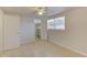 A cozy bedroom featuring tile floors, closet, and natural light from the bright window at 3205 Moog Rd, Holiday, FL 34691