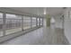 Bright Florida room with tile floors and abundant windows at 3205 Moog Rd, Holiday, FL 34691
