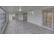 Airy Florida room with tile floors and sliding doors to the interior at 3205 Moog Rd, Holiday, FL 34691