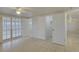 Main bedroom featuring tile floors and multiple access points to other areas at 3205 Moog Rd, Holiday, FL 34691