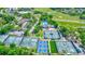 Aerial view of community with tennis courts, pool, and clubhouse at 40 Aster Pl, Oldsmar, FL 34677