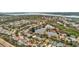 Wide aerial view of neighborhood and lake at 40 Aster Pl, Oldsmar, FL 34677