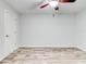 Simple bedroom with tile floors and ceiling fan at 40 Aster Pl, Oldsmar, FL 34677