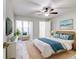 Main bedroom with ceiling fan and coastal decor at 40 Aster Pl, Oldsmar, FL 34677