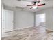 Second bedroom with ceiling fan and access to an adjacent room at 40 Aster Pl, Oldsmar, FL 34677