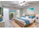 Main bedroom with coastal decor and wicker bed at 40 Aster Pl, Oldsmar, FL 34677