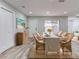 Dining area with wicker chairs and a neutral color scheme at 40 Aster Pl, Oldsmar, FL 34677