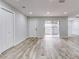 Bright living room with sliding glass doors leading to a patio at 40 Aster Pl, Oldsmar, FL 34677