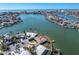 Aerial view of a waterfront home situated on a peninsula at 495 Bath Club N Blvd, North Redington Beach, FL 33708