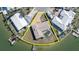 Bird's eye view of a waterfront home with a pool and private dock at 495 Bath Club N Blvd, North Redington Beach, FL 33708