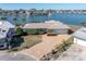 Aerial view of house with driveway and RV at 495 Bath Club N Blvd, North Redington Beach, FL 33708