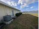 Backyard view of home with AC unit and waterfront access at 495 Bath Club N Blvd, North Redington Beach, FL 33708