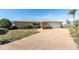 Front view of the house with a paved driveway at 495 Bath Club N Blvd, North Redington Beach, FL 33708