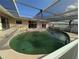 Large kidney-shaped pool with covered patio at 495 Bath Club N Blvd, North Redington Beach, FL 33708