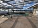 Kidney-shaped pool with screened enclosure at 495 Bath Club N Blvd, North Redington Beach, FL 33708