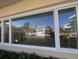 Large window showcasing waterfront views at 495 Bath Club N Blvd, North Redington Beach, FL 33708