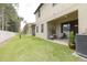 Private backyard with grassy area and covered patio at 5152 Bay Isle Cir, Clearwater, FL 33760