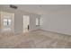 Spacious carpeted bedroom with ensuite bathroom access at 5152 Bay Isle Cir, Clearwater, FL 33760