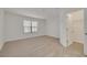 Bright bedroom with carpeted floor and walk-in closet at 5152 Bay Isle Cir, Clearwater, FL 33760